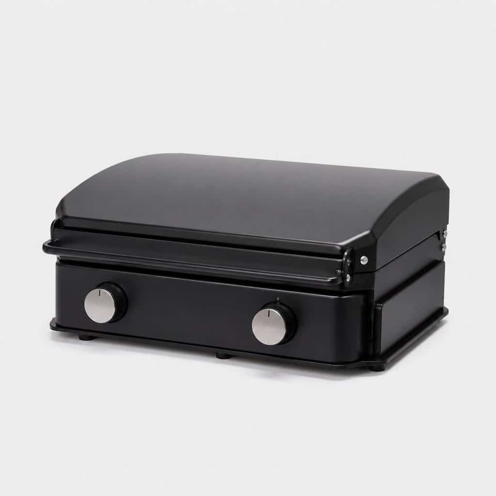 Barbecue à gaz compact pour camping-car à deux brûleurs vu de trois quarts sur fond neutre